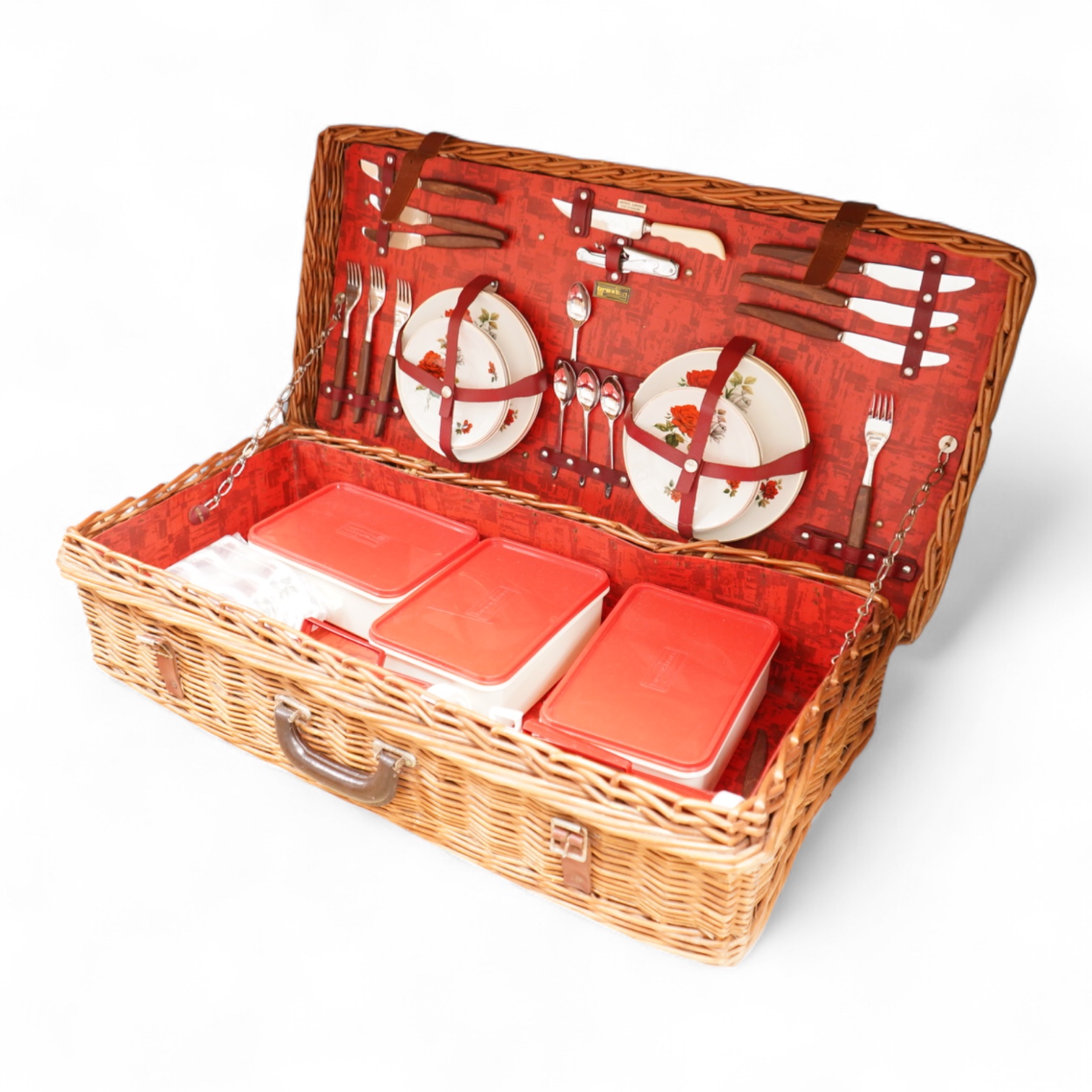 An Asprey wicker picnic basket, fully fitted with contents